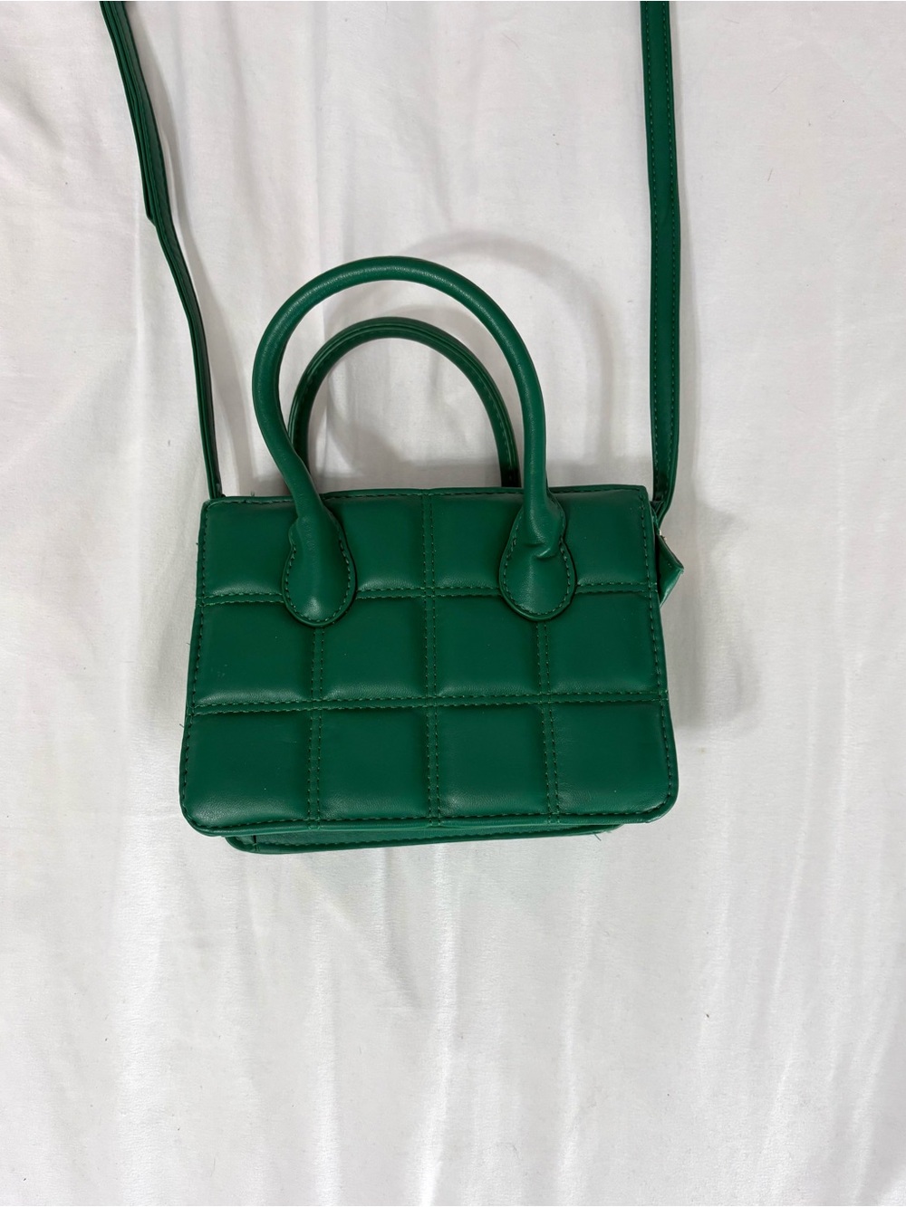Green quilted mini handbag with removable adjustable crossbody strap